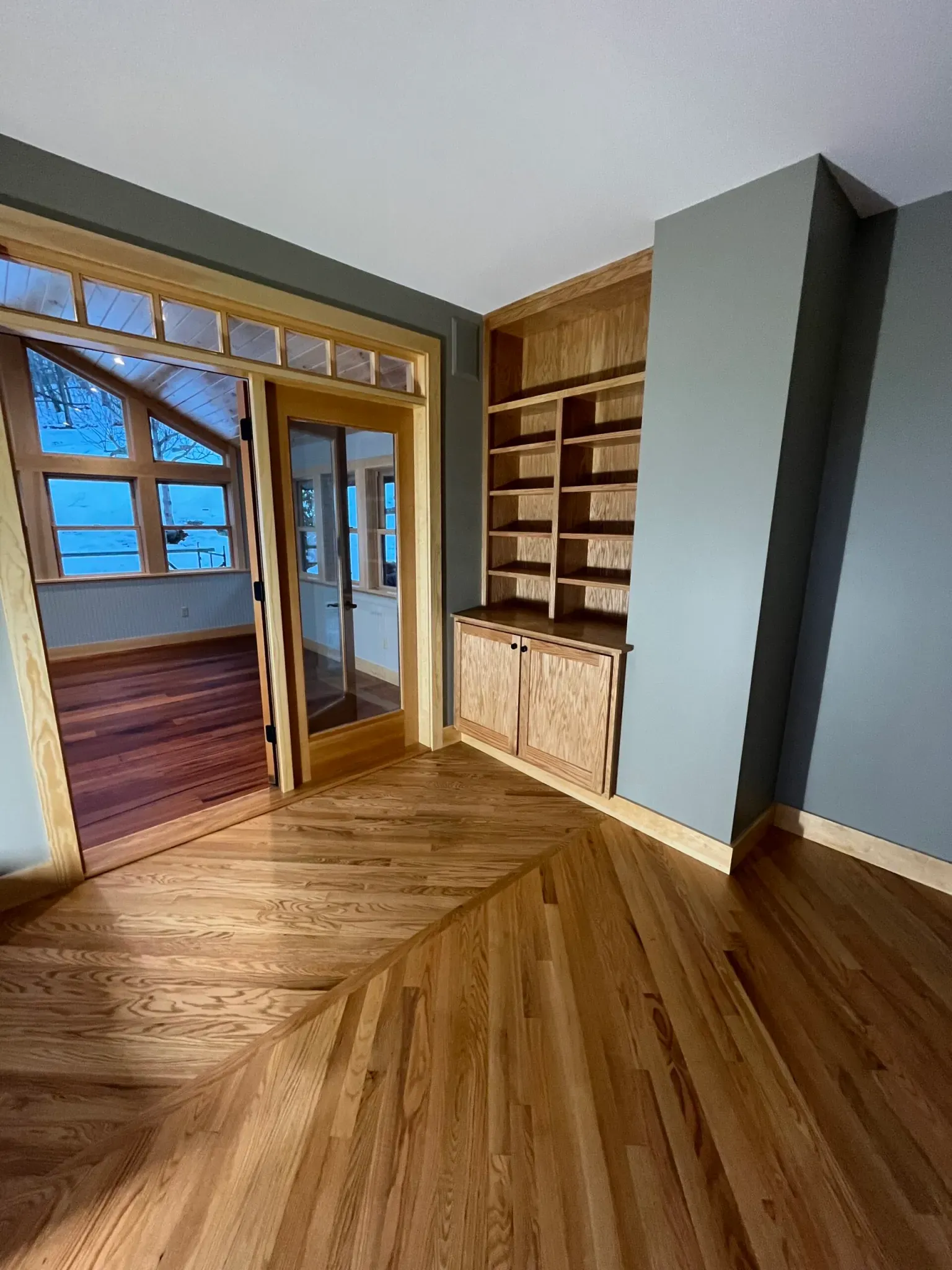 Custom built-in bookshelf with hardwood flooring