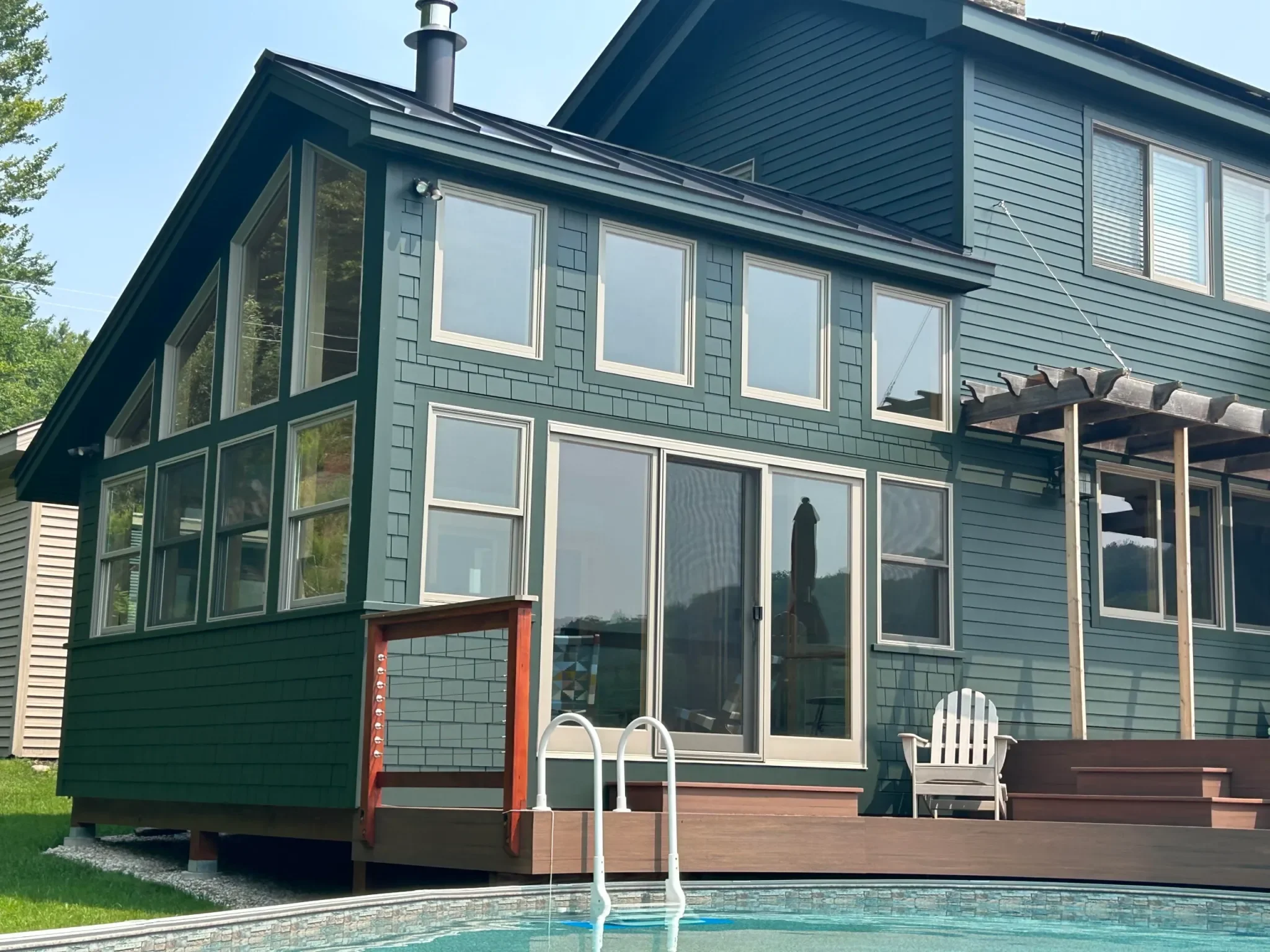 Custom home addition with pool and deck, built by Burnham Custom Building and Remodeling in Berkshire County, MA