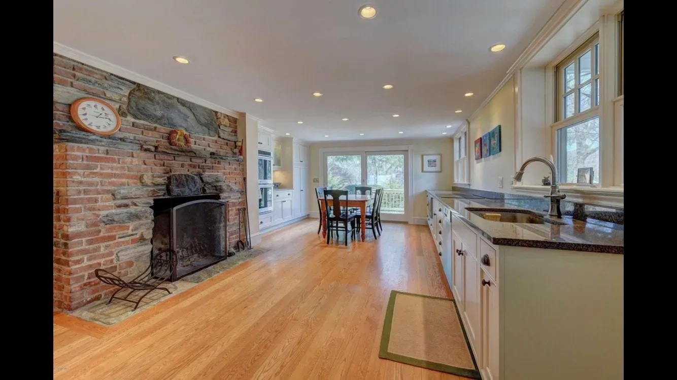 Kitchen remodel with exposed brick fireplace