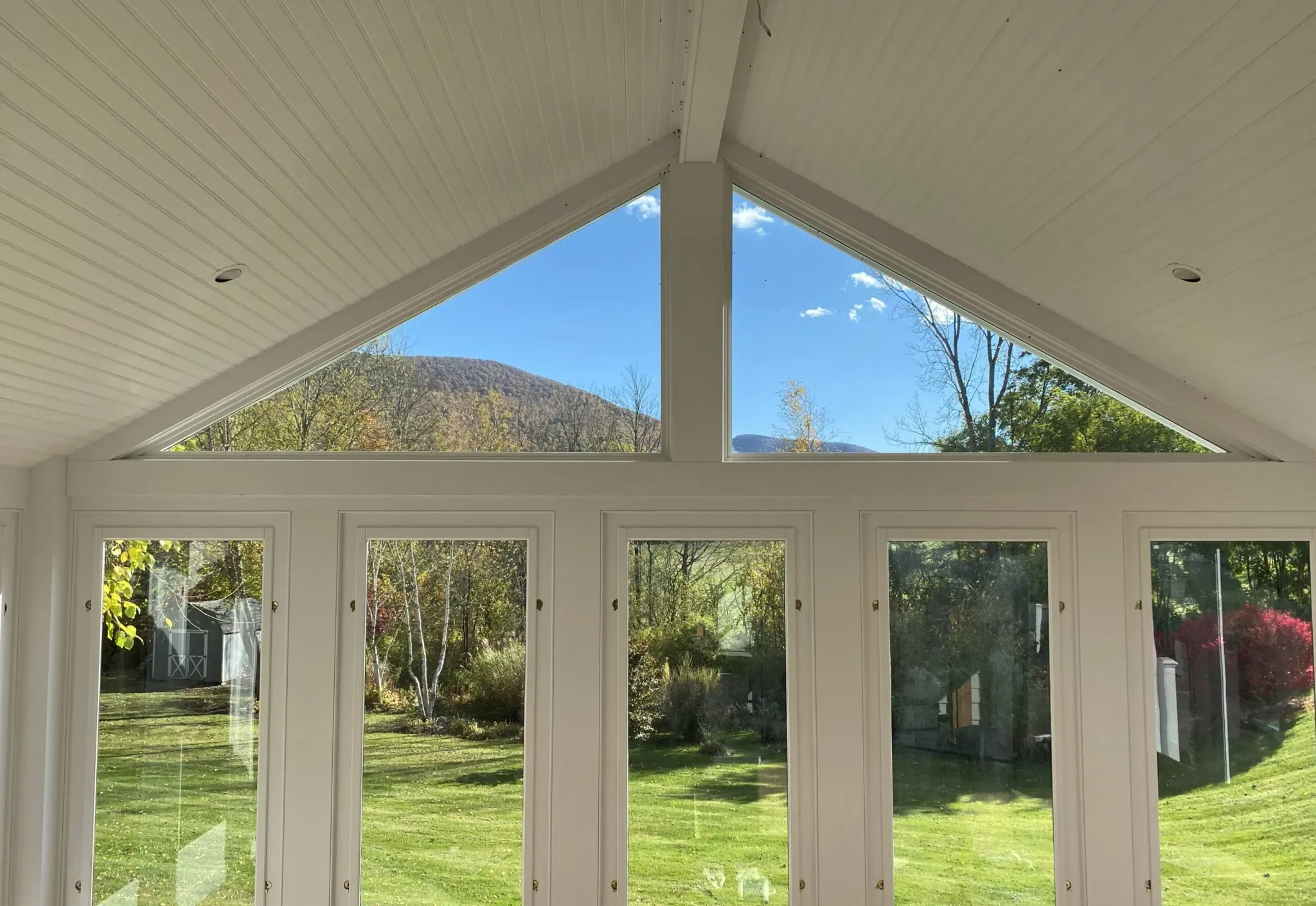 Sunroom addition interior with mountain view