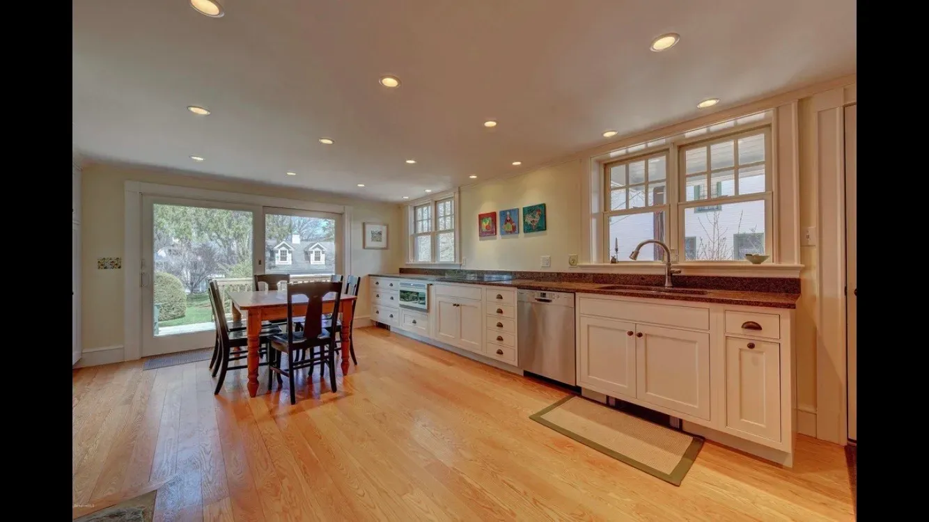 White kitchen remodel with dining area